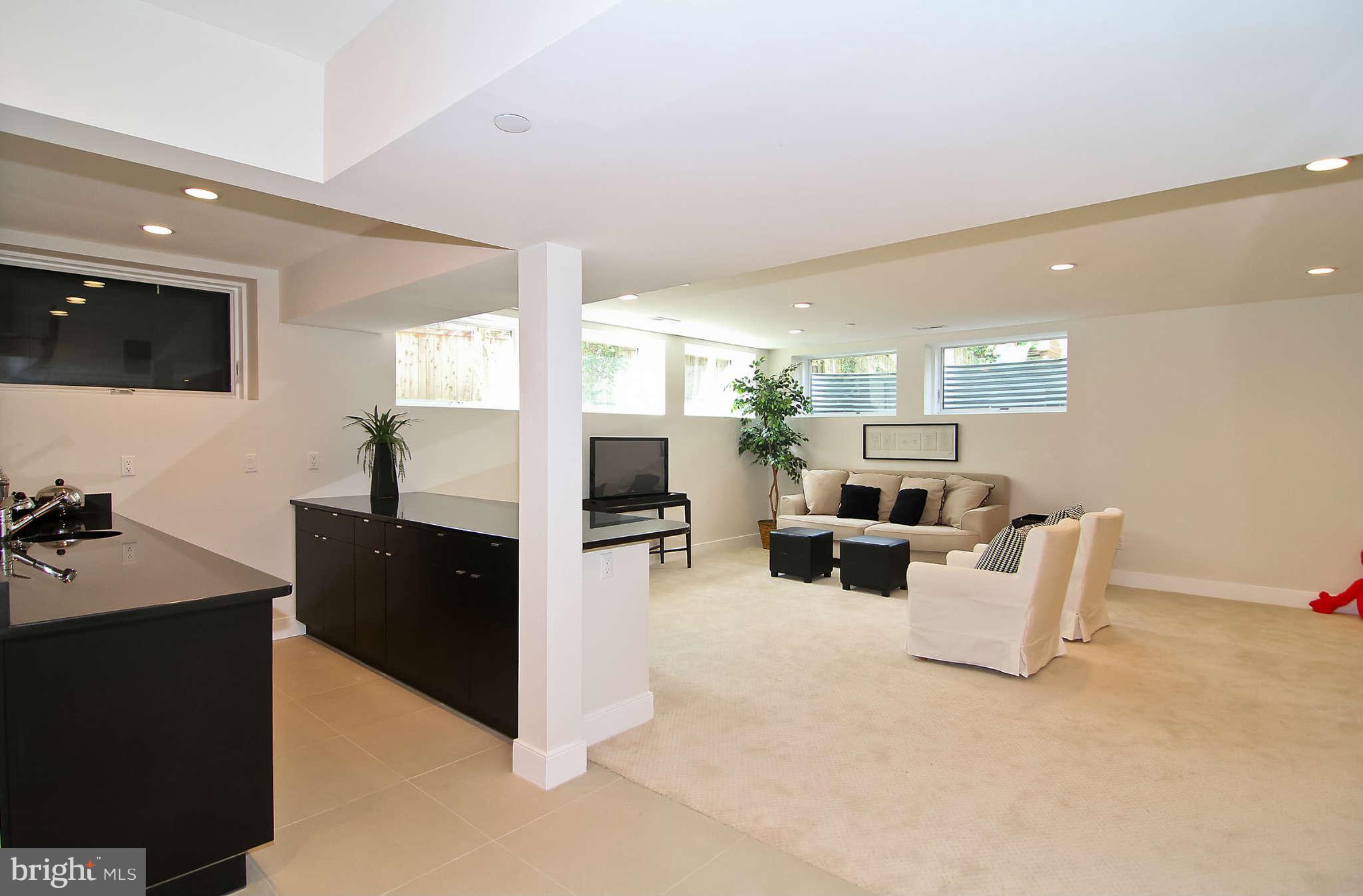 5610 Warwick Place Chevy Chase, MD 20815 - Photo 24 of 30 Oversized recreation room with custom granite bar