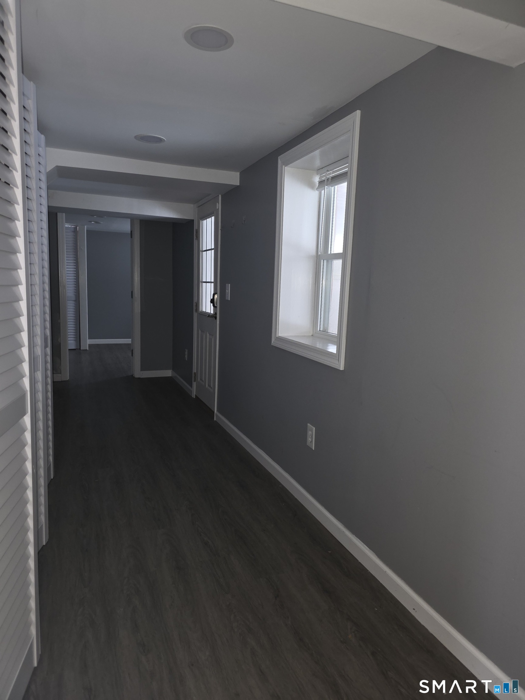 856 Shagbark Drive Orange, CT 06477 - Photo 34 of 36 Basement hallway with separate entry if so needed