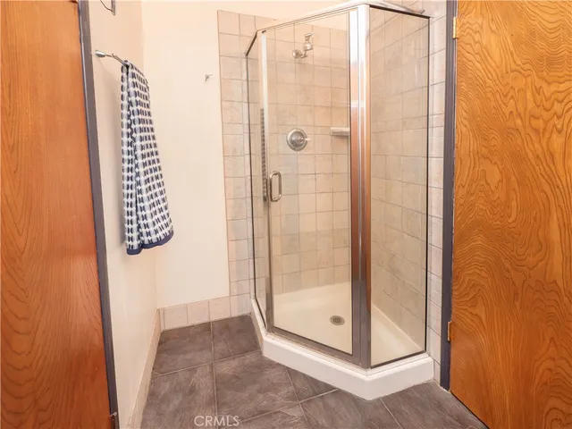 a bathroom with a glass shower door