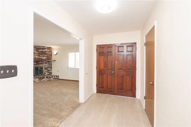 a view of a room with furniture and window