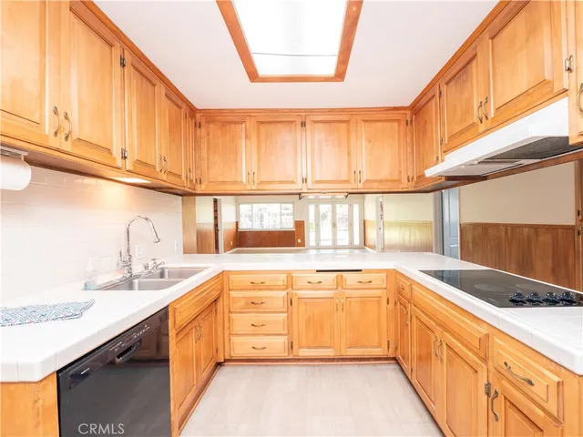 a kitchen with a sink and a window