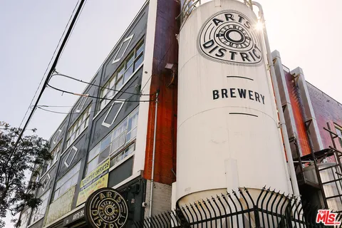 a view of a brick house with a large window