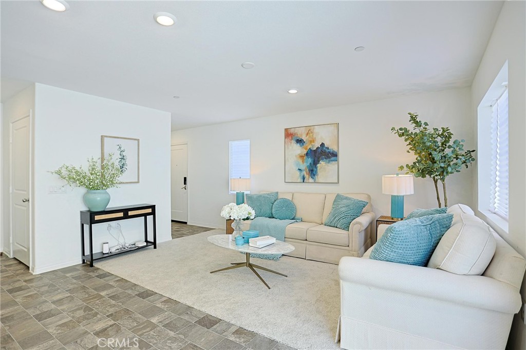 7486 Olive Grv Street Riverside, CA 92507 - Photo 3 of 57 a living room with furniture and a potted plant