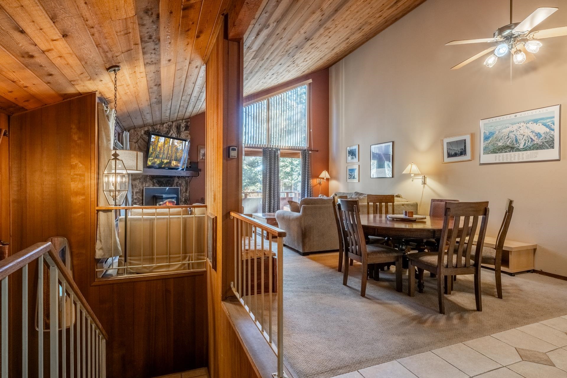 2112 Meridian Boulevard, Unit 7 Mammoth Lakes, CA 93546 - Photo 10 of 33 Dining space featuring light tile patterned floors, light carpet, high vaulted ceiling, wooden ceiling, and a ceiling fan