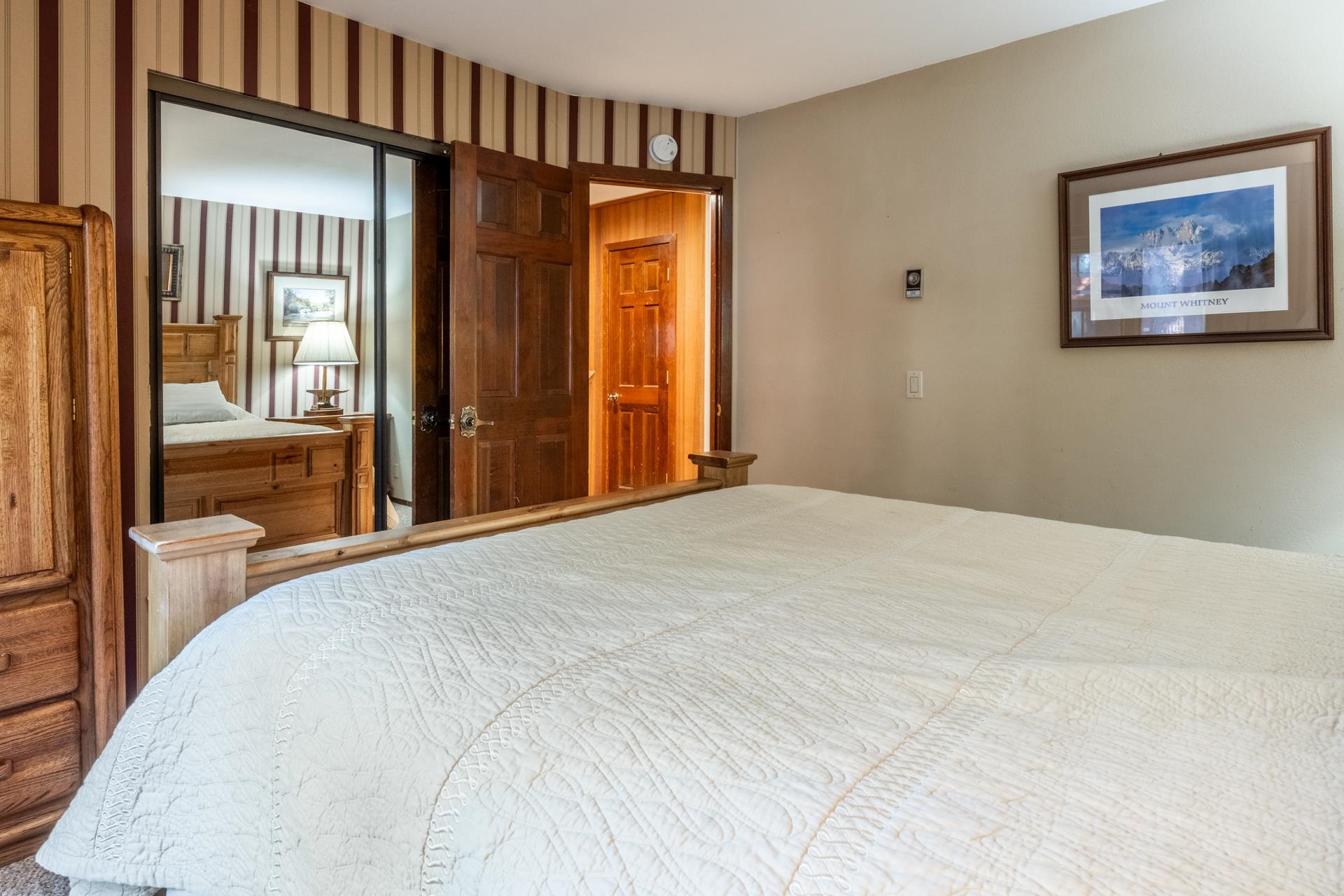 2112 Meridian Boulevard, Unit 7 Mammoth Lakes, CA 93546 - Photo 16 of 33 Bedroom with wallpapered walls