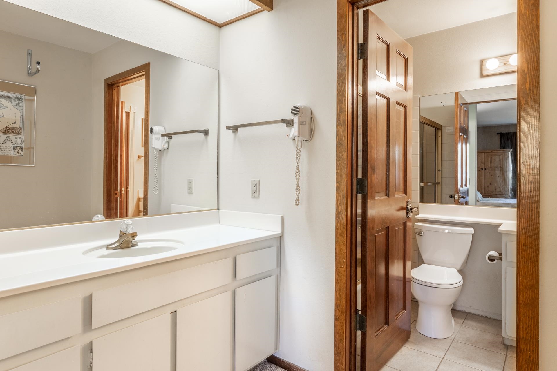 2112 Meridian Boulevard, Unit 7 Mammoth Lakes, CA 93546 - Photo 22 of 33 Full bathroom with light tile patterned floors, vanity, and a shower