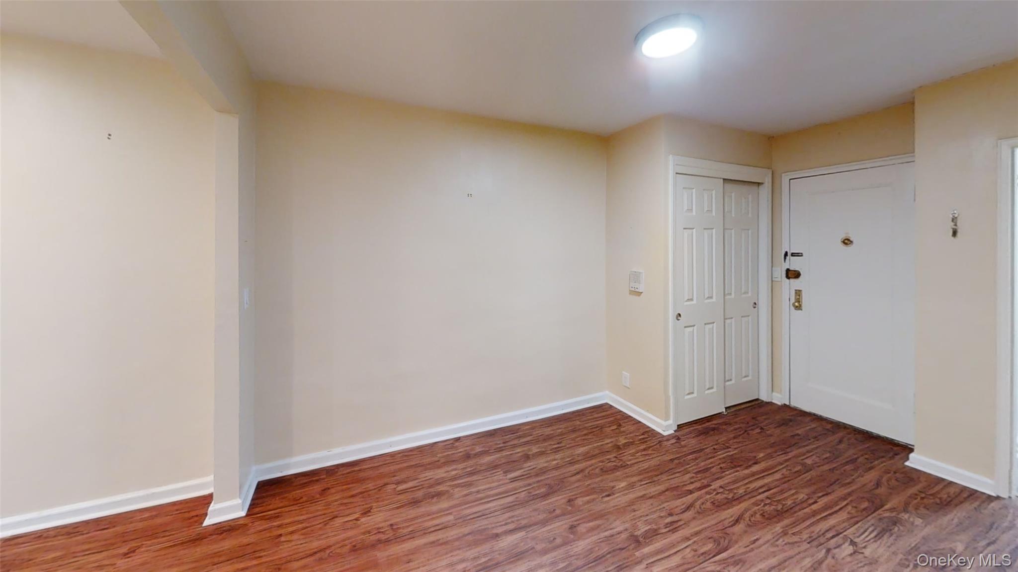 50 White Oak Street, Unit 4B New Rochelle, NY 10801 - Photo 19 of 20 a view of an empty room with wooden floor