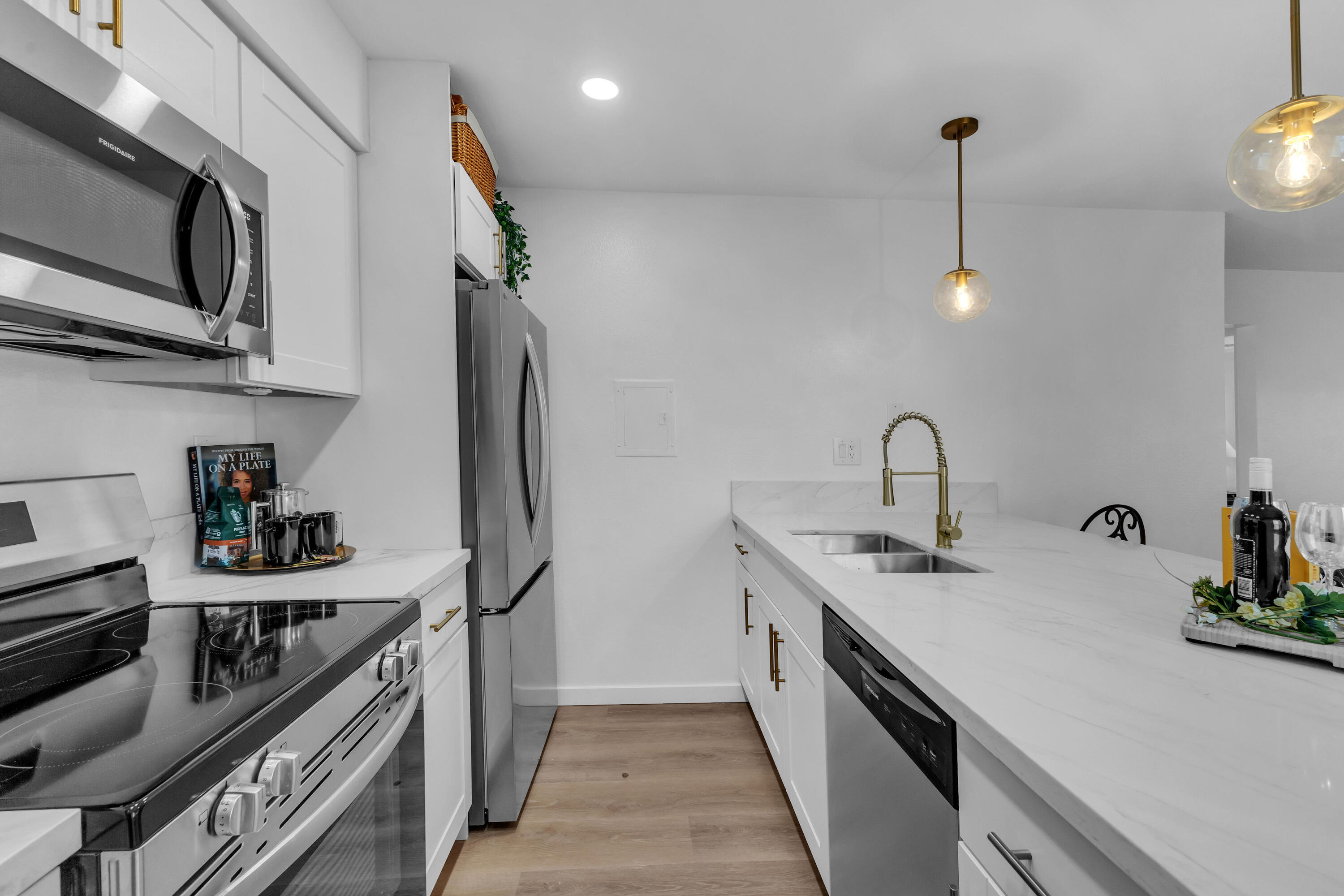 72682 Thrush Road, Unit 1 Palm Desert, CA 92260 - Photo 7 of 40 a kitchen with stainless steel appliances a sink stove and refrigerator