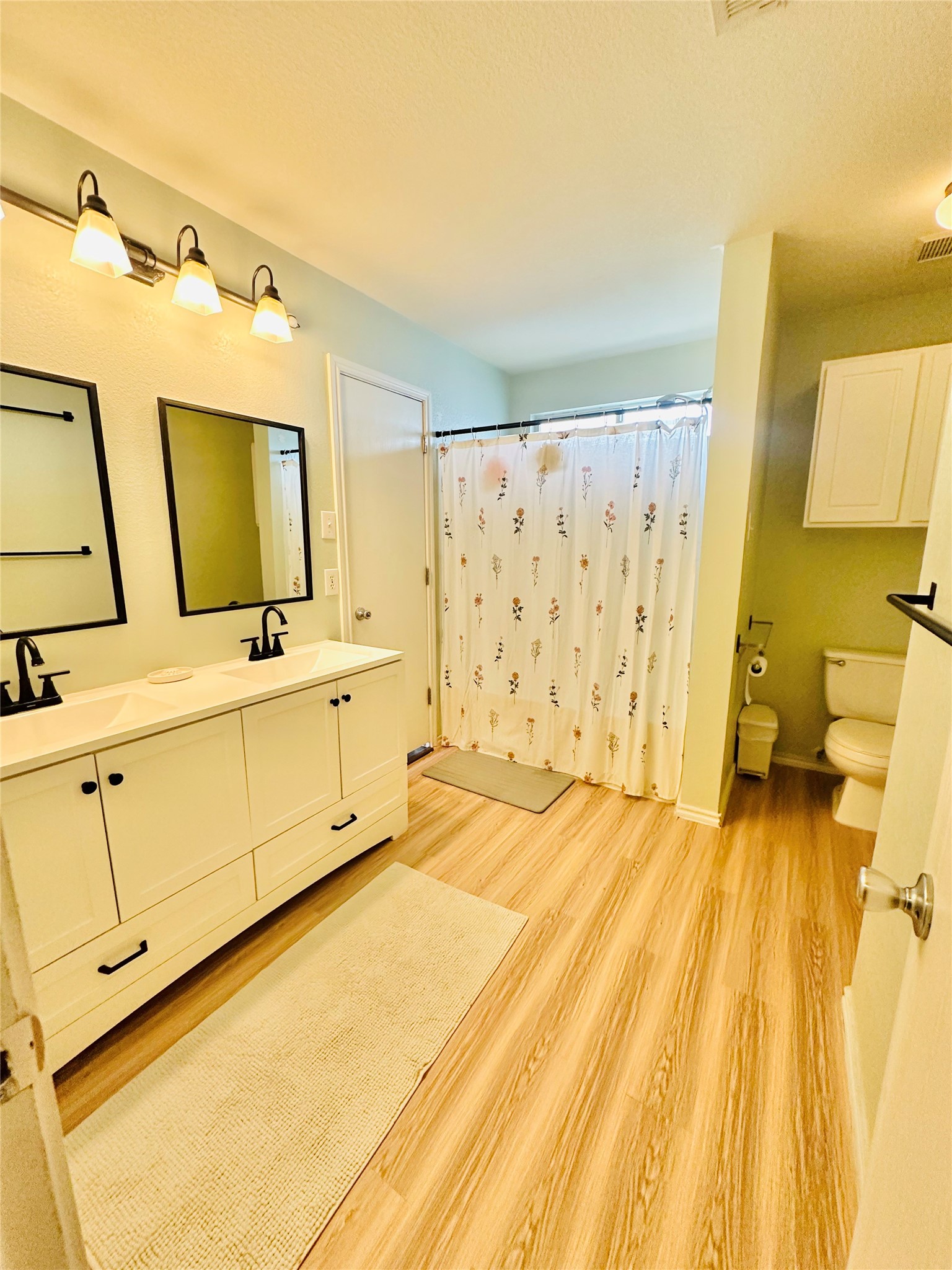 602 Lavaca Loop Elgin, TX 78621 - Photo 14 of 28 a bathroom with a sink mirror and a shower