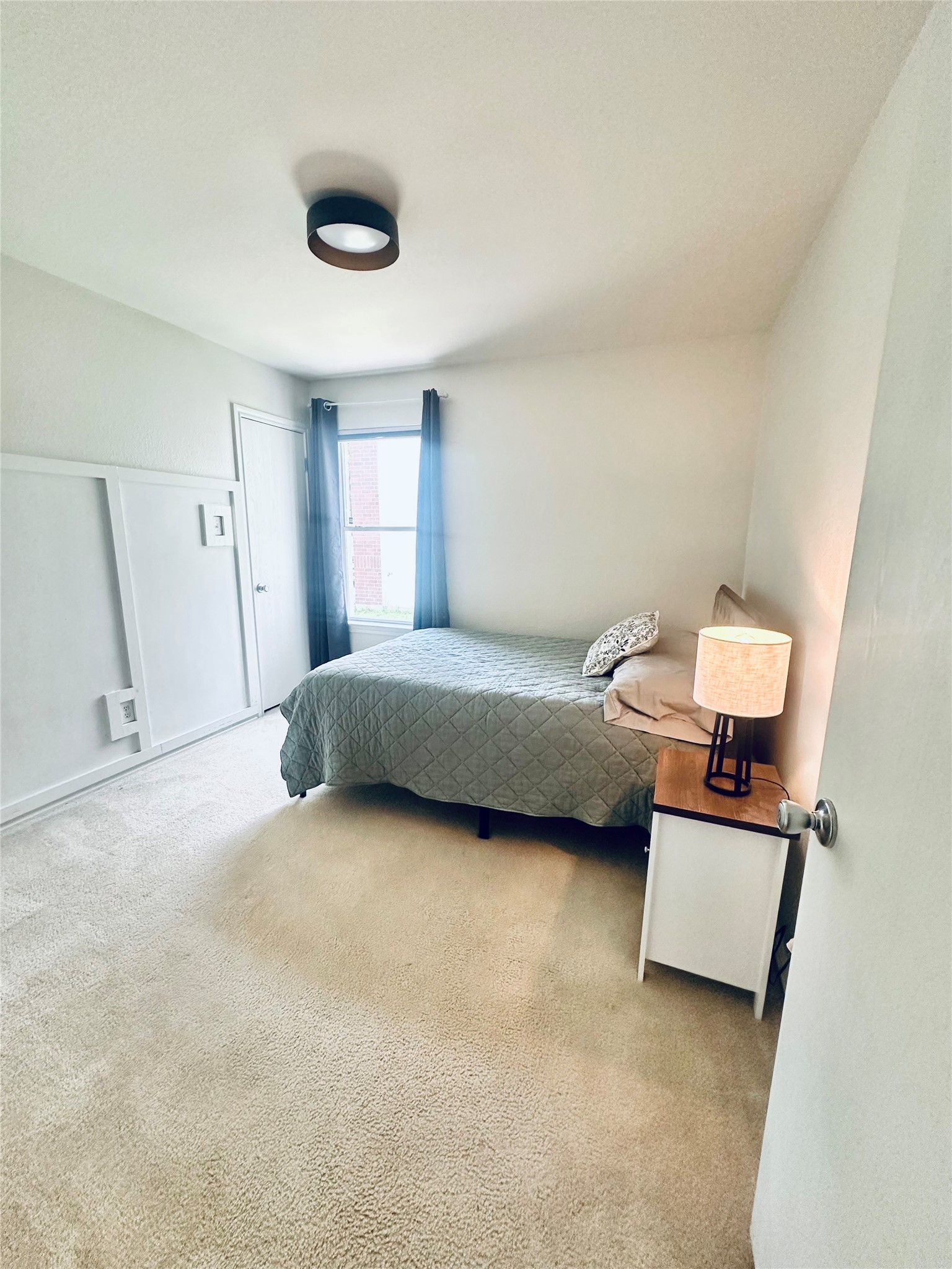 602 Lavaca Loop Elgin, TX 78621 - Photo 17 of 28 a bedroom with a bed and a couch