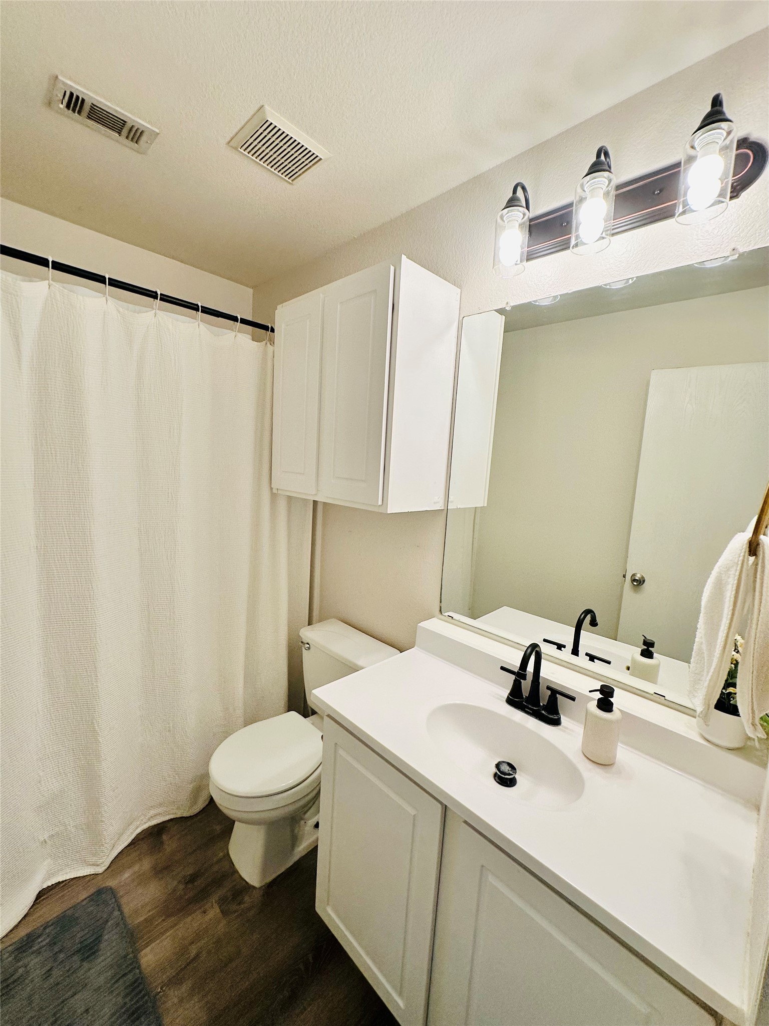 602 Lavaca Loop Elgin, TX 78621 - Photo 18 of 28 a bathroom with a sink and a toilet