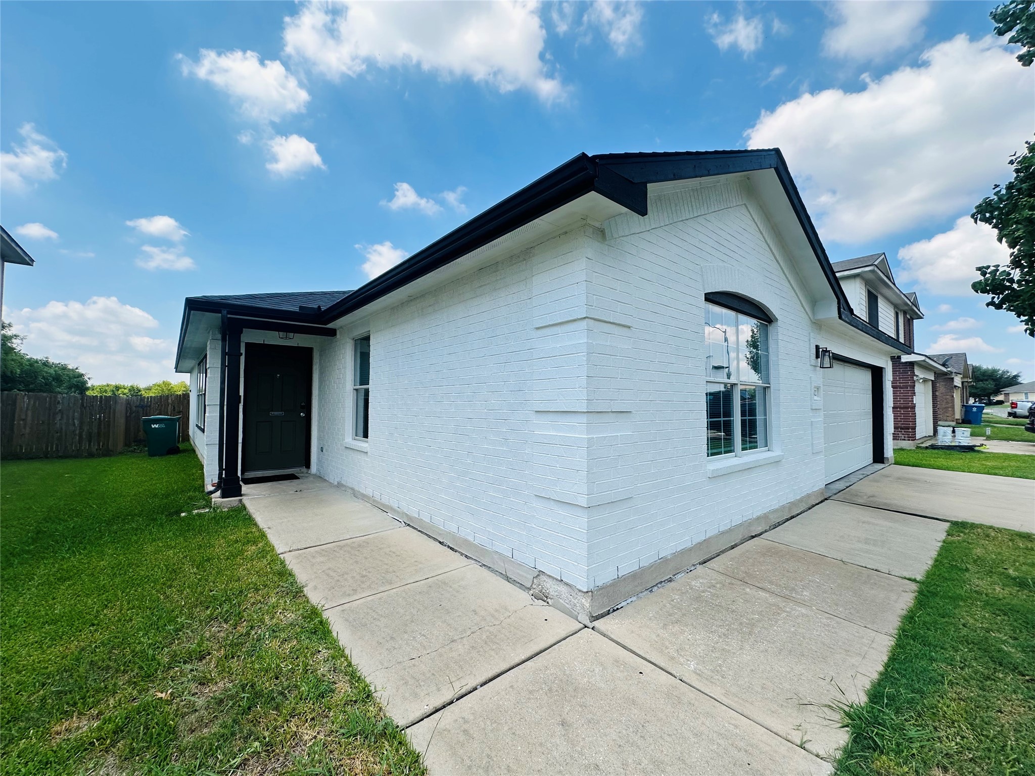 602 Lavaca Loop Elgin, TX 78621 - Photo 2 of 28 a front view of a house with a yard