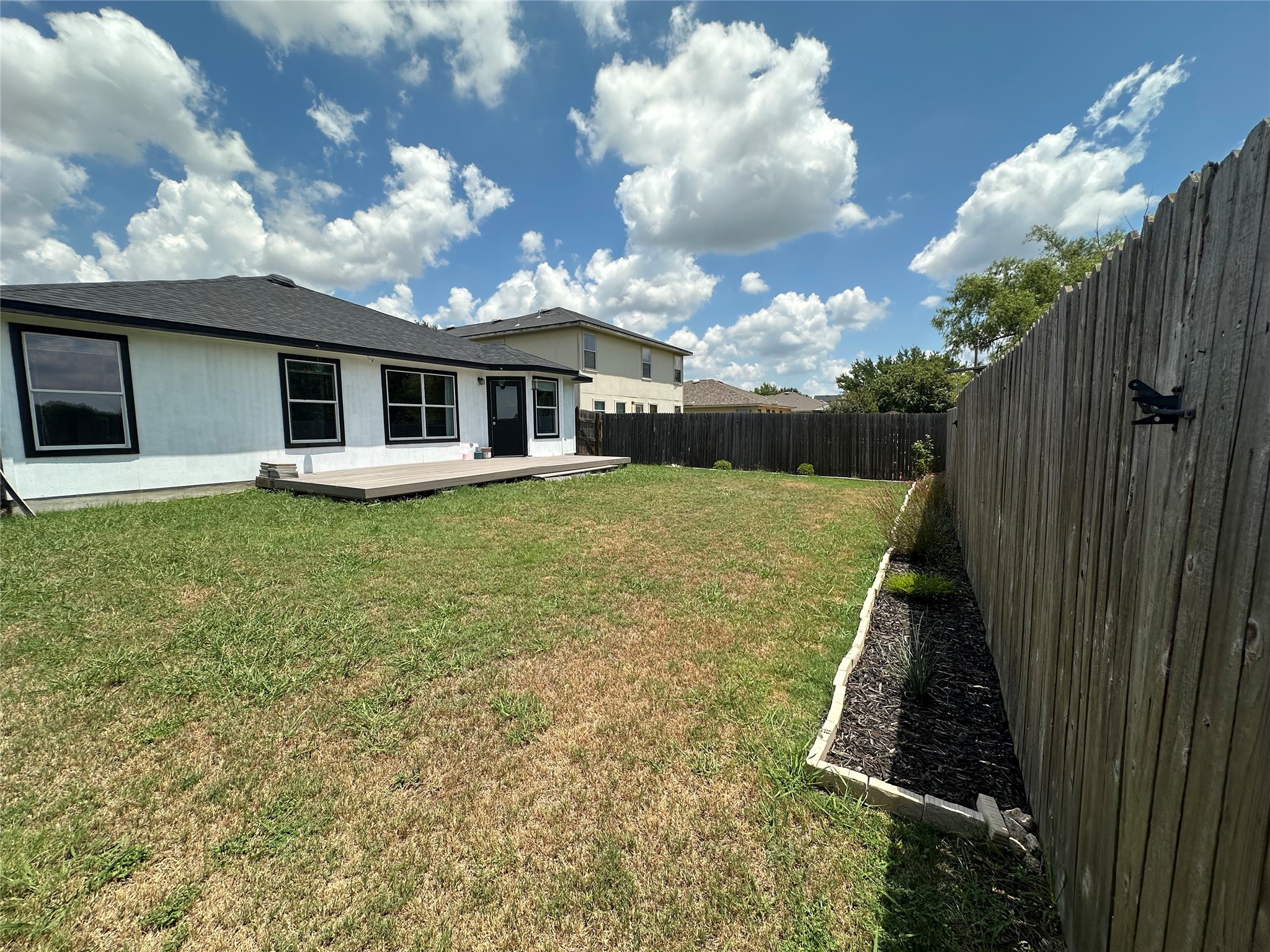 602 Lavaca Loop Elgin, TX 78621 - Photo 26 of 28 a view of a house with a yard