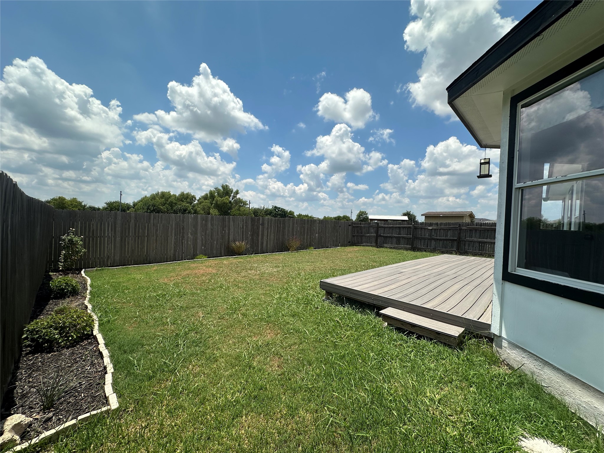 602 Lavaca Loop Elgin, TX 78621 - Photo 27 of 28 a view of a backyard with sitting area