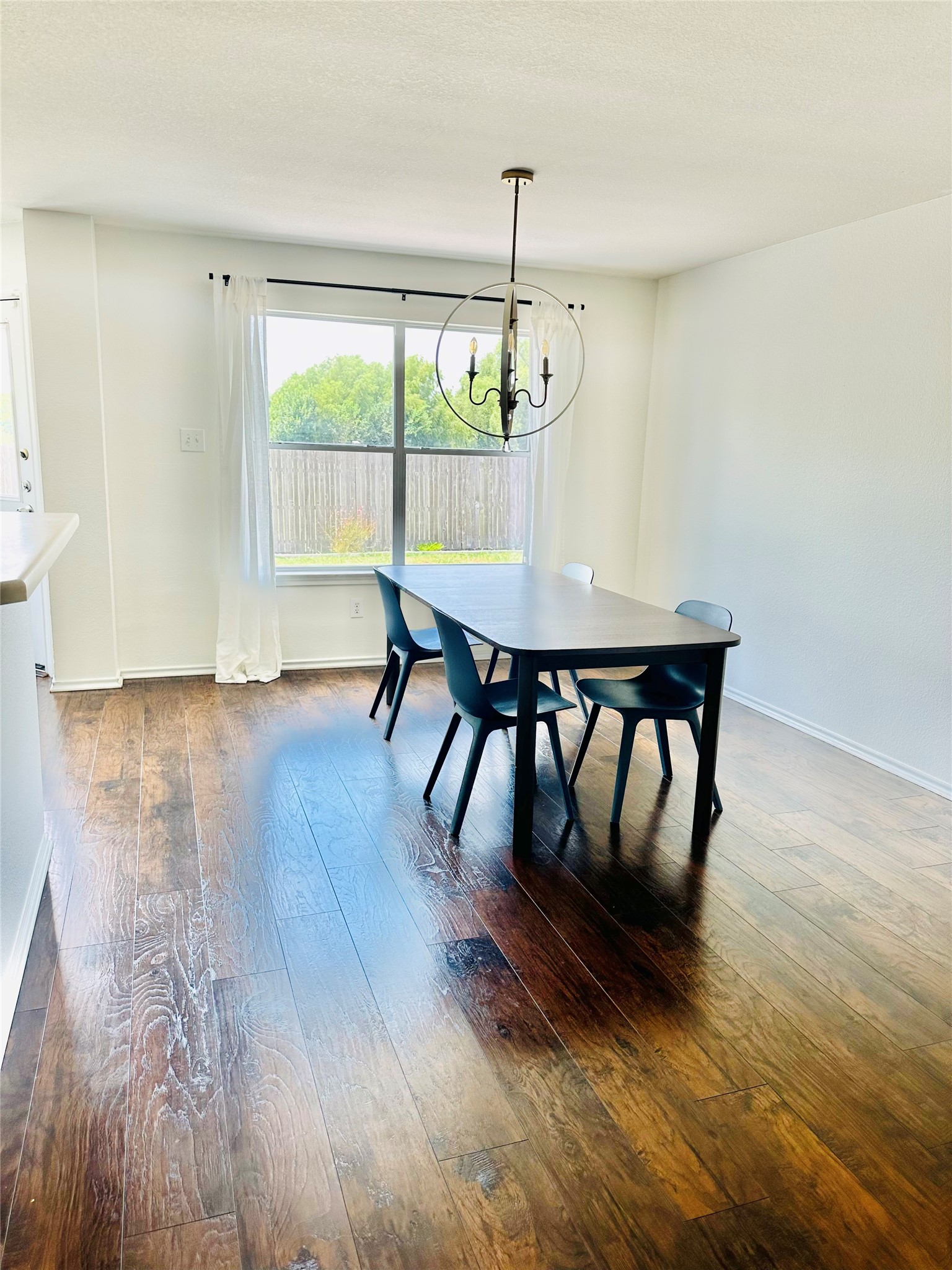 602 Lavaca Loop Elgin, TX 78621 - Photo 6 of 28 a view of a dining room with furniture window and wooden floor
