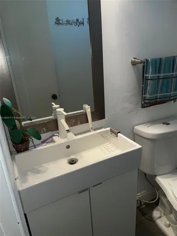 a bathroom with a sink and a toilet