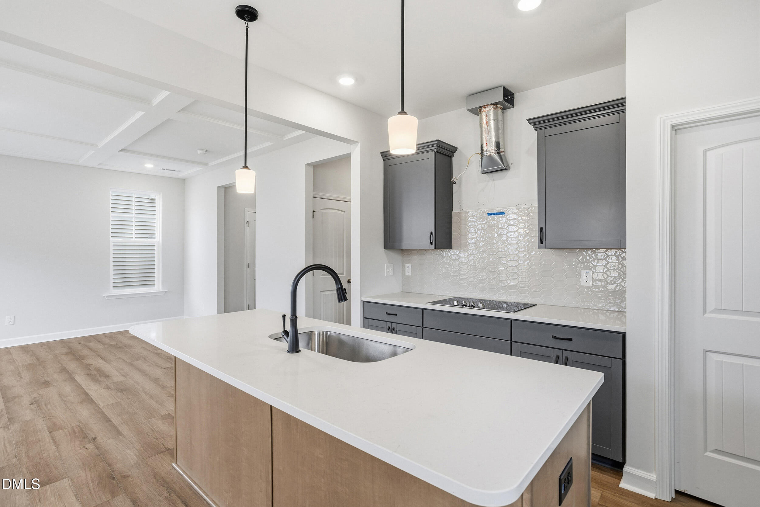 288 Meadowbark Bend, Unit 37 Garner, NC 27529 - Photo 11 of 50 a kitchen with a sink a counter space appliances and cabinets