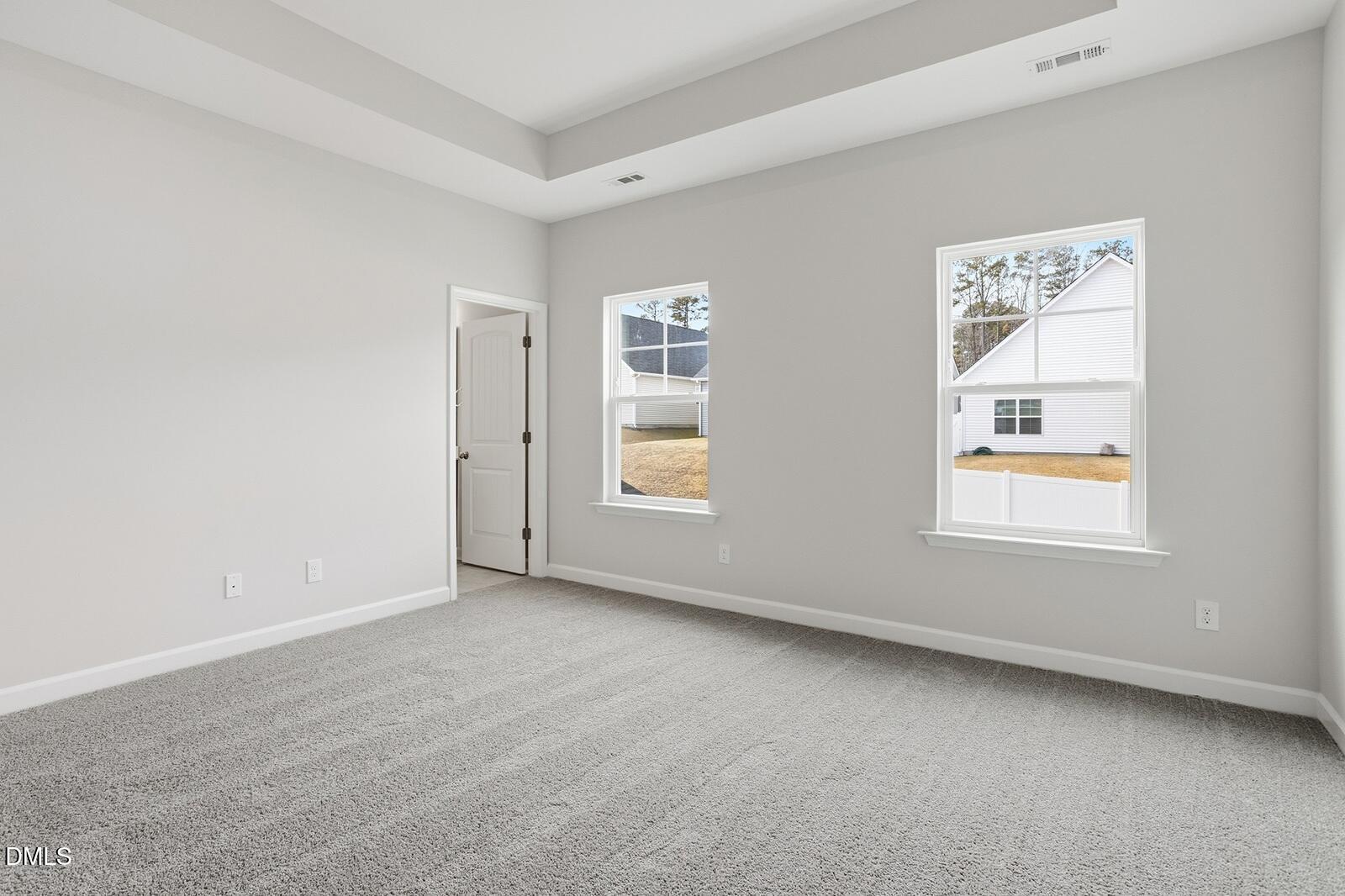 288 Meadowbark Bend, Unit 37 Garner, NC 27529 - Photo 20 of 50 an empty room with windows