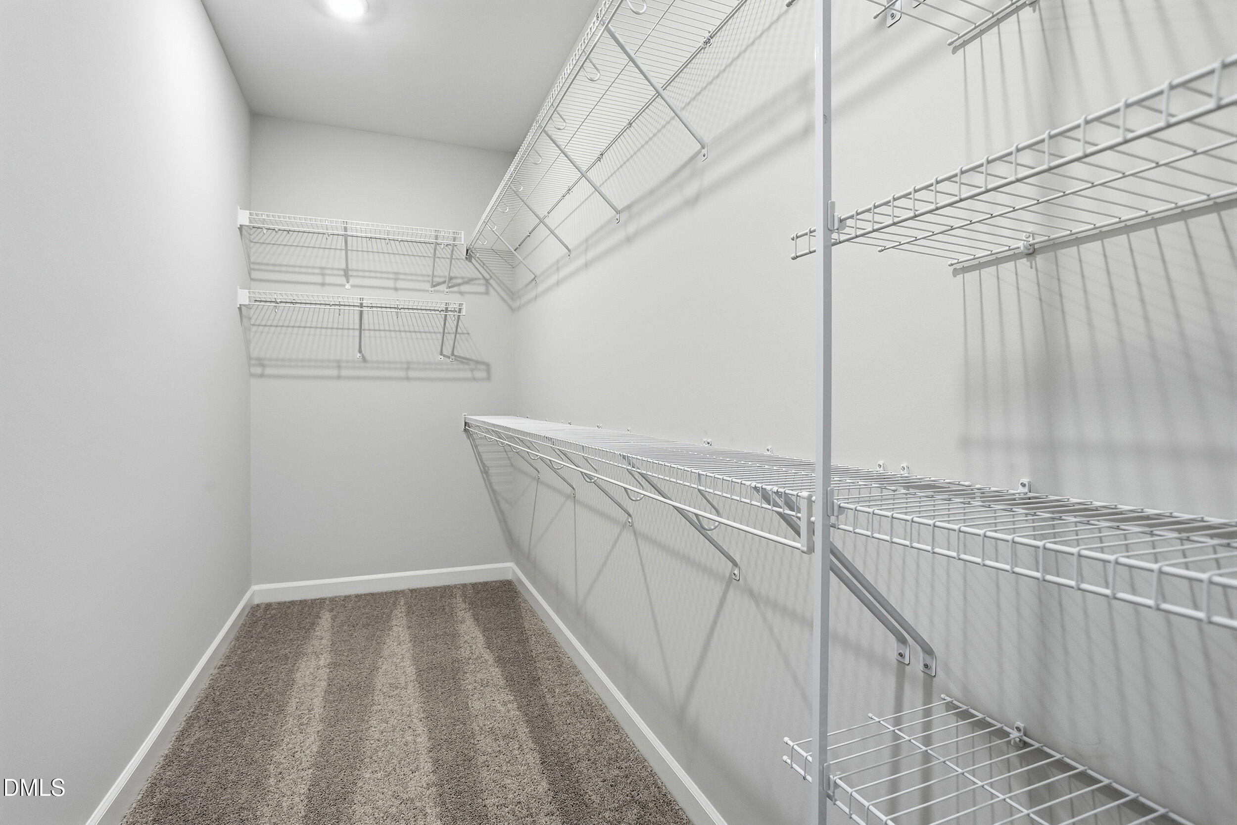 288 Meadowbark Bend, Unit 37 Garner, NC 27529 - Photo 23 of 50 a view of a room with racks on the wall