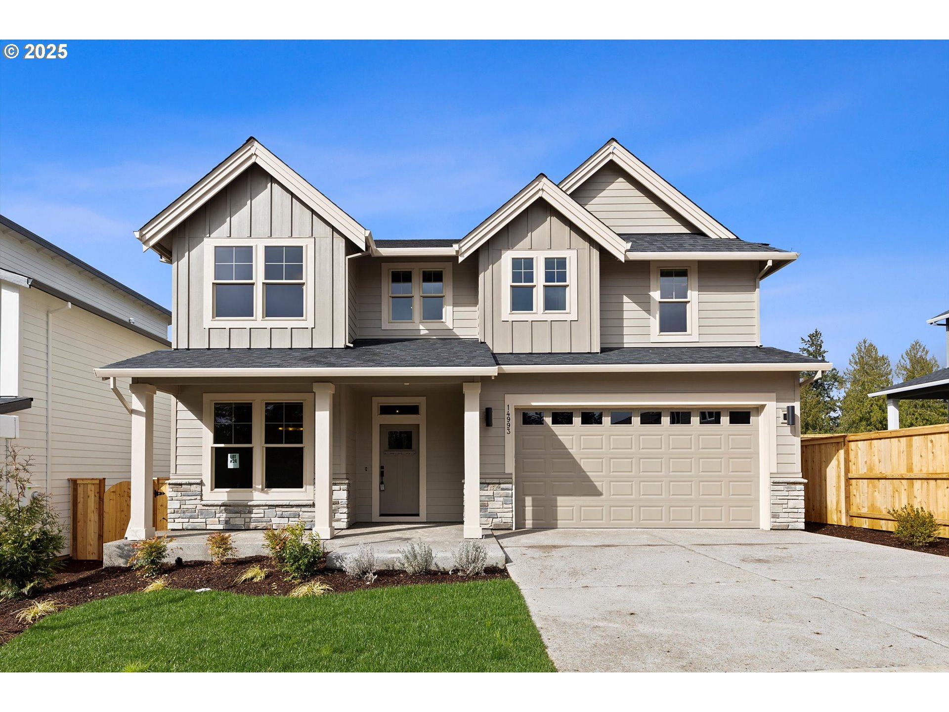 14993 Southeast Andre Way Clackamas, OR 97015 - Photo 1 of 43 a front view of a house with a yard and garage