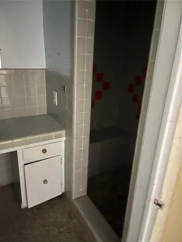 a view of storage and utility room with empty racks