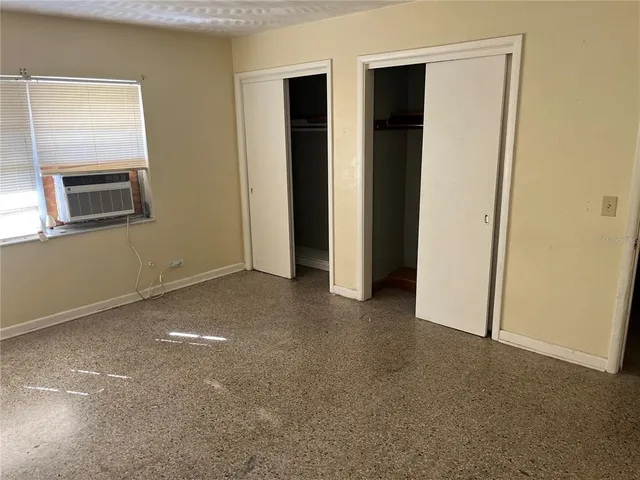 a view of hallway with sink and wooden floor