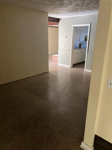 a kitchen with a sink cabinets and a window
