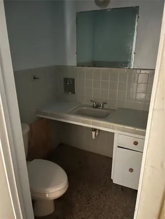 a view of a sink and a mirror