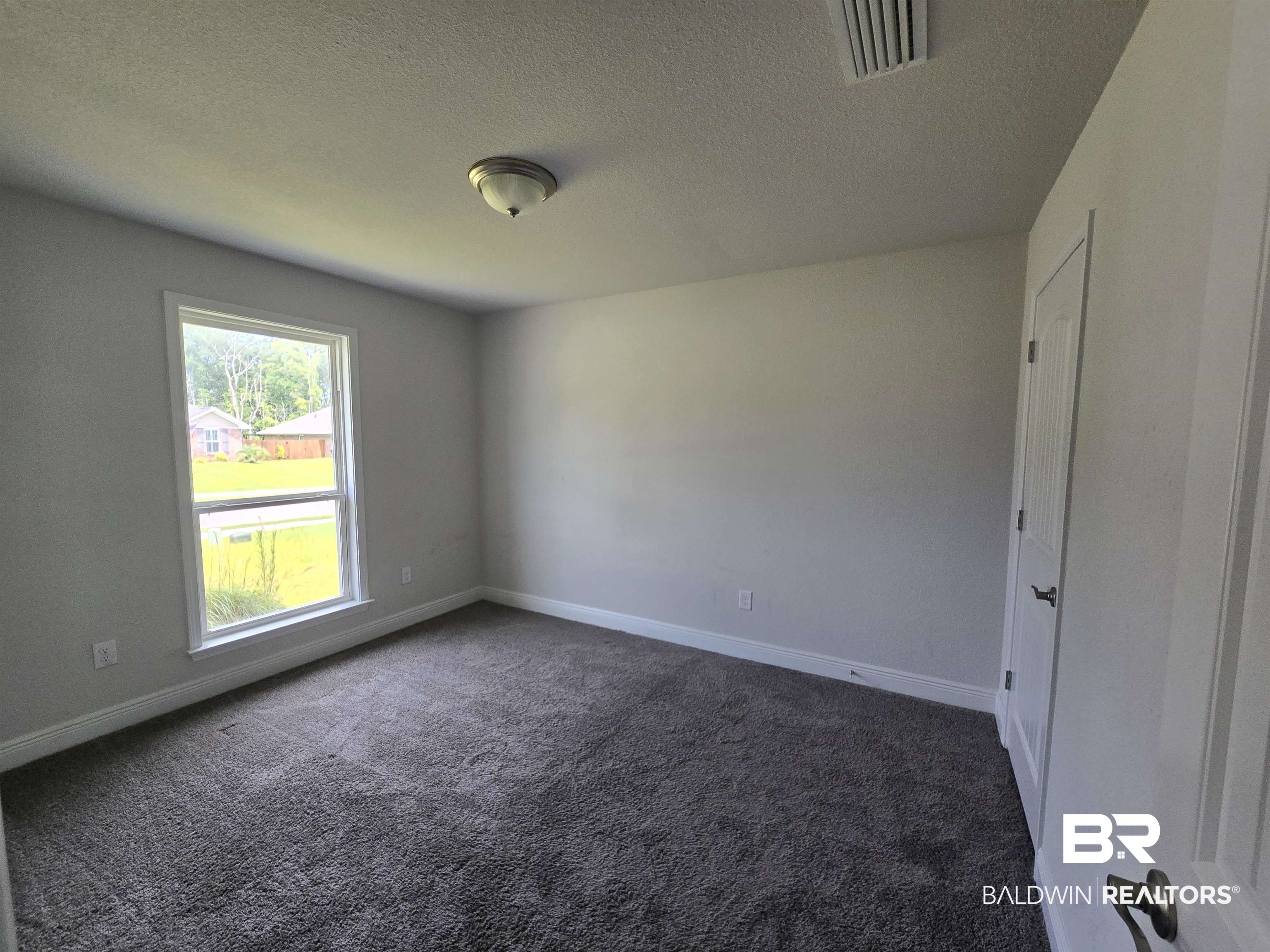 23035 Ridgewood Drive Robertsdale, AL 36567 - Photo 11 of 17 Guest Bedroom 1