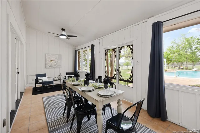 a view of a dining room with furniture window and outside view