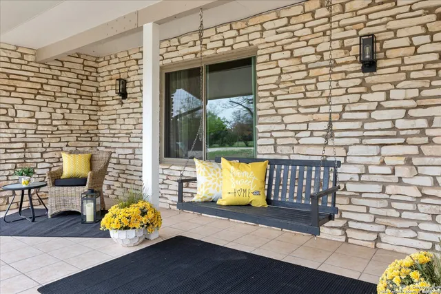 a living room with furniture and a dining table