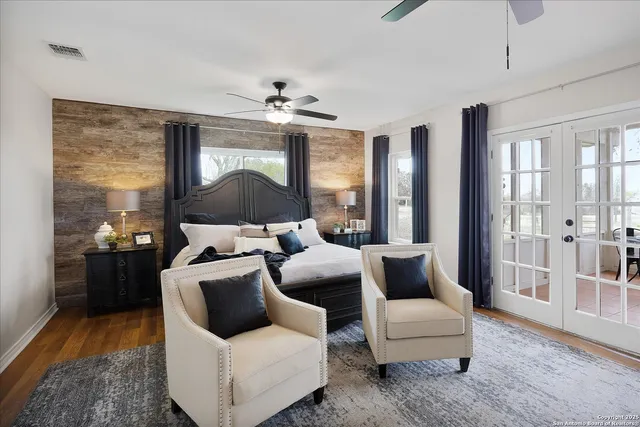 a living room with fireplace furniture and a flat screen tv