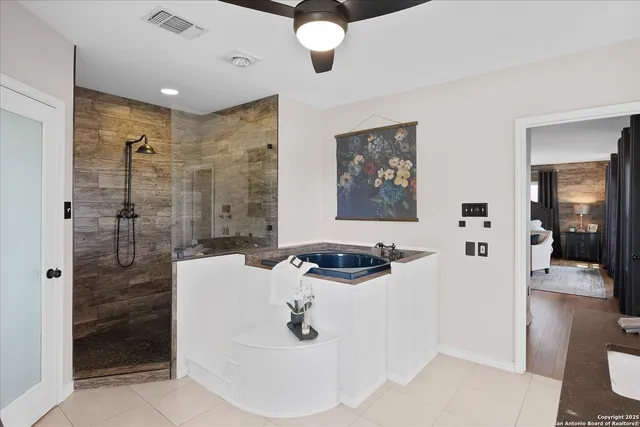 a view of a swimming pool with lawn chairs under an umbrella