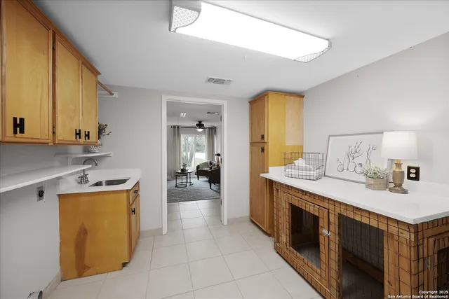 a view of a patio with a table chairs and a yard