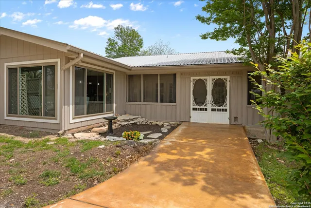 a very nice looking room with a large window and wooden floor