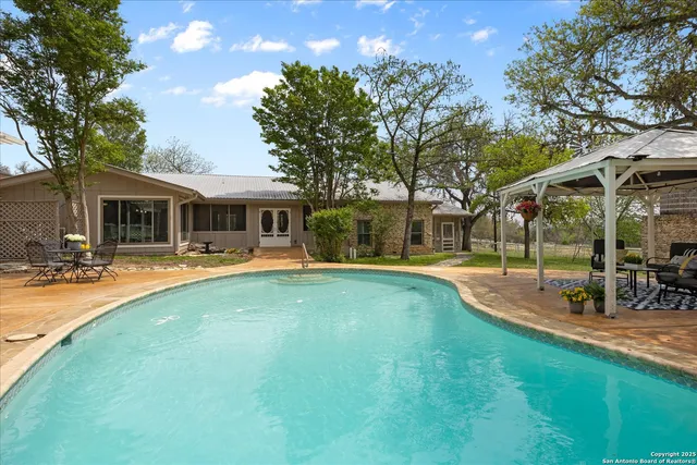 a large kitchen with a table and chairs