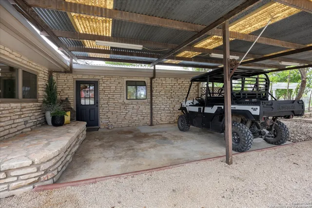a bathroom with a granite countertop sink a mirror and vanity