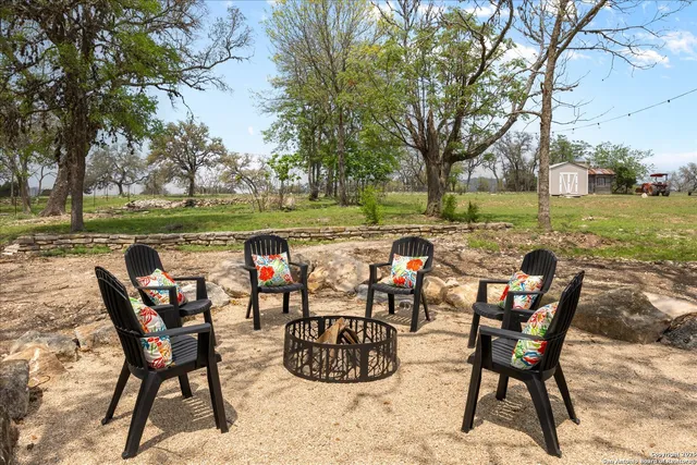 a view of a field with an trees