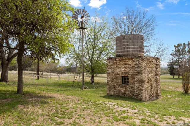 a view of a mountain in the distance in a field