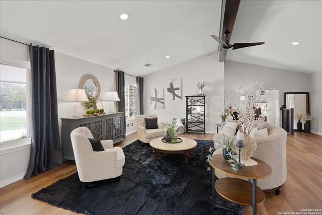 a living room with furniture and a window