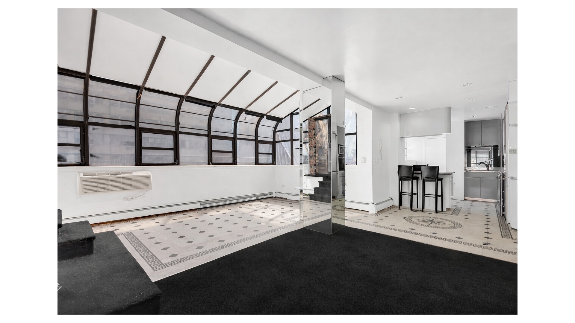 40 Sutton Place, Unit PHM Manhattan, NY 10022 - Photo 2 of 12 a view of an entryway with a table and chair