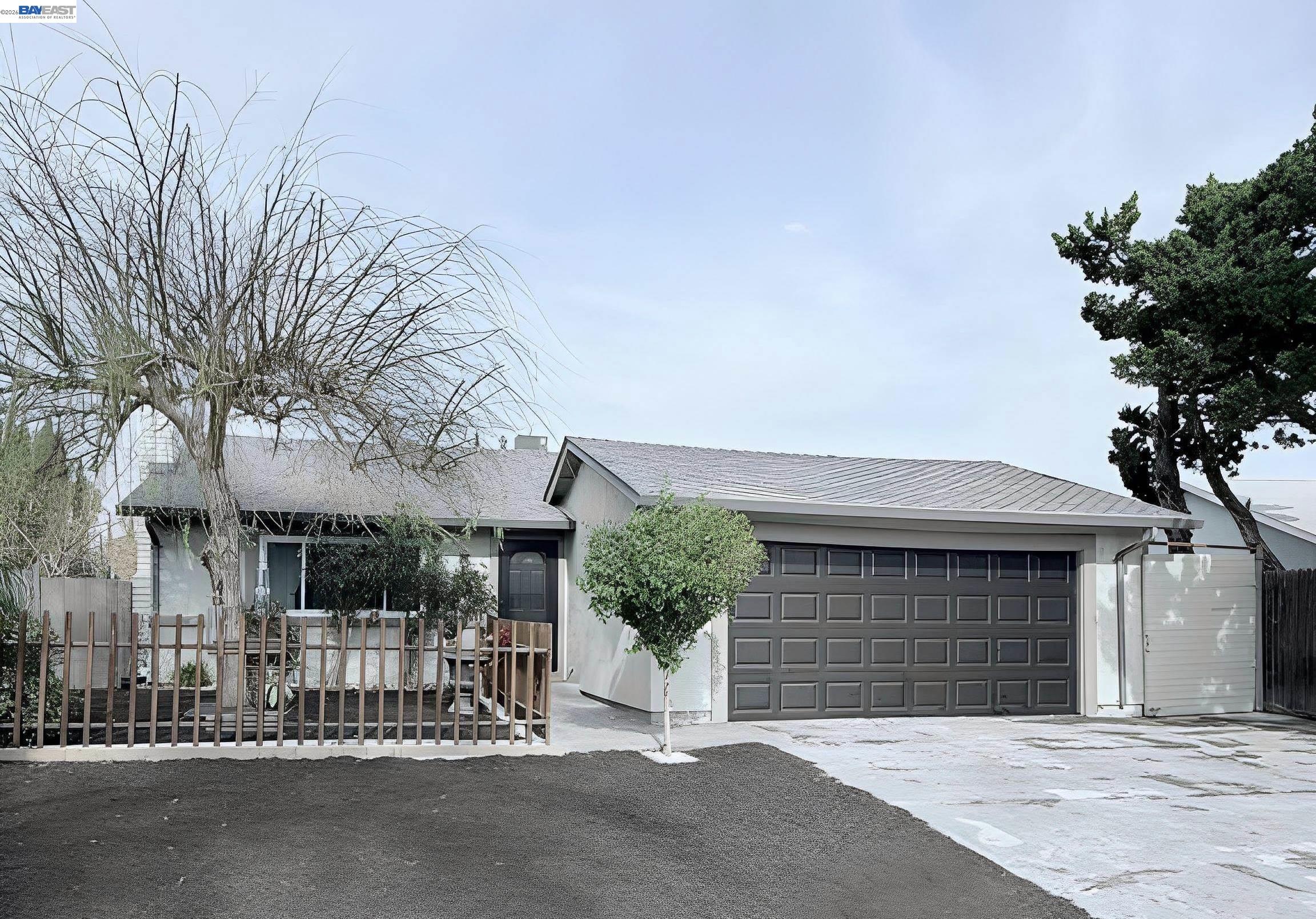 1651 West Beverly Place Tracy, CA 95376 - Photo 1 of 1 a front view of a house with a garage