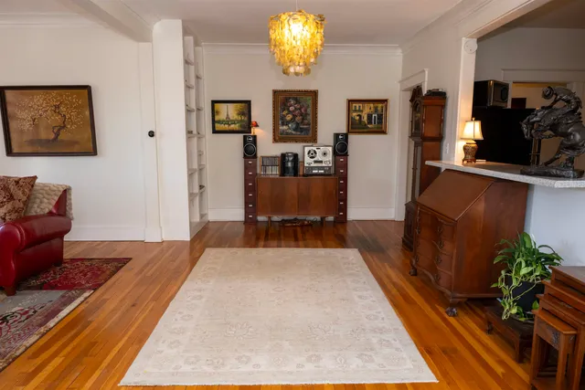 a bedroom with furniture and a rug
