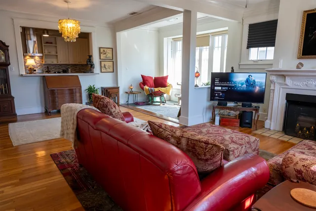 a living room with furniture fireplace and flat screen tv