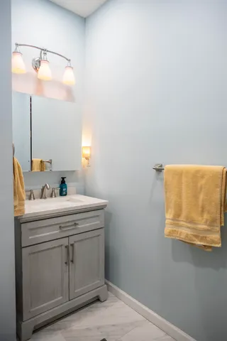 a bathroom with a sink and a mirror