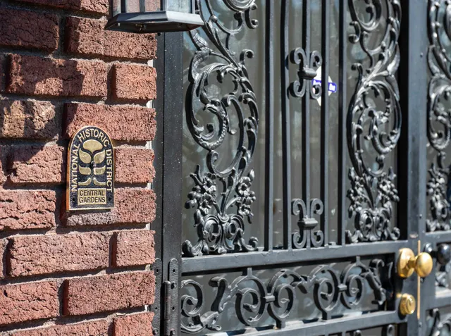 a view of a entryway door with wooden fence