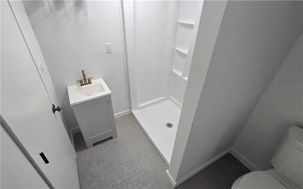 a bathroom with sink and mirror