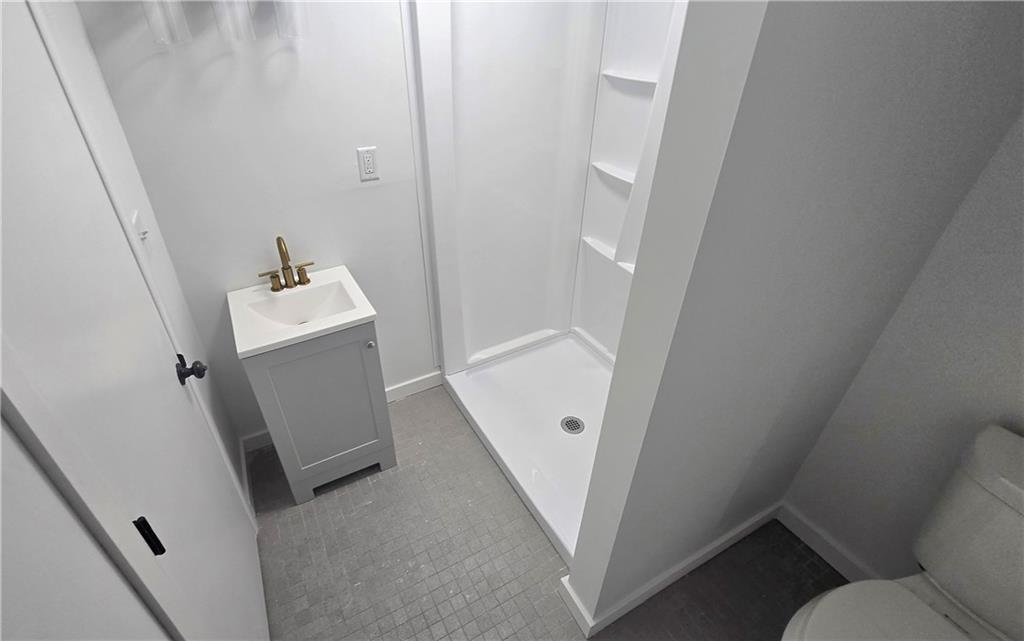 4560 Friendship Avenue Pittsburgh, PA 15224 - Photo 11 of 20 a bathroom with sink and mirror