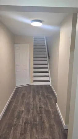 a view of a hallway with stairs