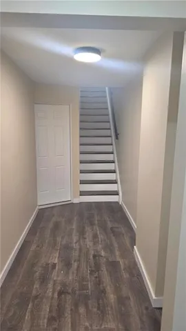 a view of a hallway with stairs